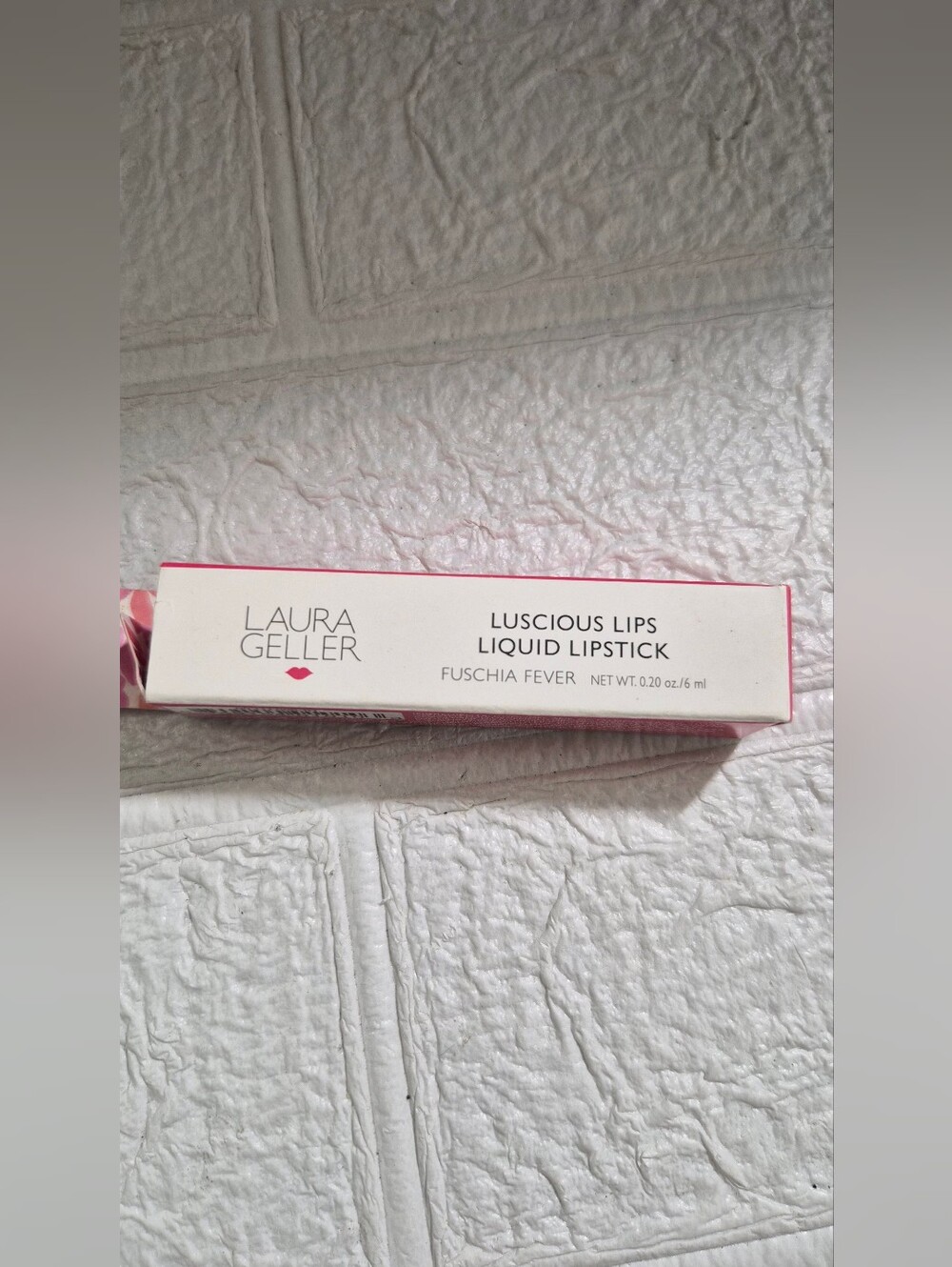 Laura Geller Luscious Lips Liquid Lipstick packaging in the shade Fuschia Fever